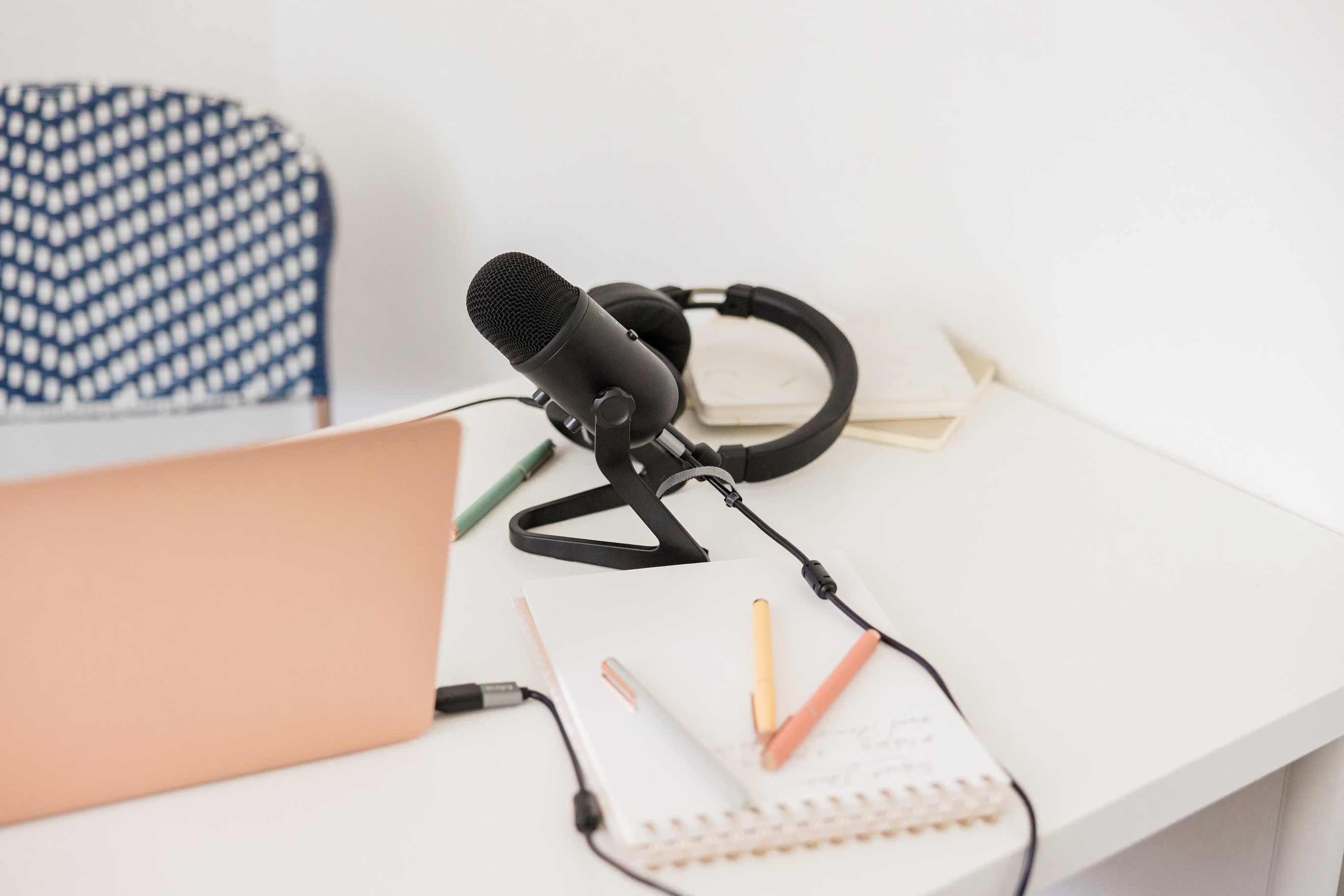 Microphone and Laptop on Table with Stationery